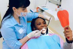 Woman smiling after cosmetic dental treatment
